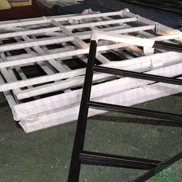 Victorian style steel and glass greenhouse for garden